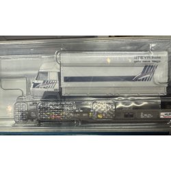 Roco HO 67530 HUPAC lavgulvsvogn mellem mellemliggende vogne "Rullende landevej" lastet med et Steyr-vogntog.